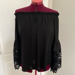 Joseph Ribkoff off-shoulder blouse with lace sleeve detail. Black. Size 10.